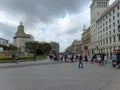 Street in Barcelona, Spain showing Iberostar and Urban Fitters with people walking and shopping