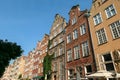 Gdansk - A close up of the facades of tall building in the middle of Old Town in Poland. The buildings have many bright colors