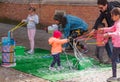 Children blowing bubbles at a vendor Royalty Free Stock Photo