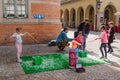 Children blowing bubbles at a vendor Royalty Free Stock Photo