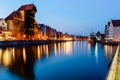 Gdansk night city riverside view. View on famous crane and facades of old medieval houses Royalty Free Stock Photo