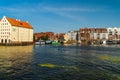 Gdansk, North Poland - August 13, 2020: People riding kayak enjoying summer in motlawa river adjacent to polish architecture near