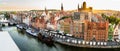 Gdansk, North Poland - August 13, 2020: Wide angle panoramic aerial shot of Motlawa river embankment in Old Town during sunset in