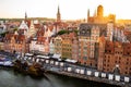 Gdansk, North Poland - Wide angle panoramic aerial shot of Motlawa river embankment in Old Town during sunset in Royalty Free Stock Photo