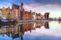 Gdansk with old town and port crane reflected in Motlawa river at sunrise, Poland Royalty Free Stock Photo