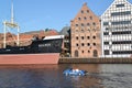 GDANSK, POLAND. A walking catamaran sails against the ship Soldek and the Central Maritime Museum