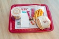 Grander Burger meal with drink and french fries at KFC Kentucky Fried Chicken restaurant. Royalty Free Stock Photo