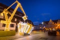 Gdansk, Poland - January 5, 2020: Illuminated decorations in the shape of crane lifting christmas present in Gdansk, Poland.