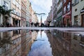 Gdansk, Poland - January 2018: city main street reflection in the puddle