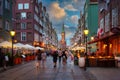 Gdansk, Poland - July 4, 2022: People are walking on the beautiful old town in Gdansk with historical city hall at sunset, Poland Royalty Free Stock Photo