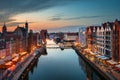 Gdansk, Poland - June 17, 2023: The Main Town of Gdansk with the historic port Crane over the Motlawa river at sunset, Poland Royalty Free Stock Photo