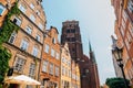 Piwna Street old buildings and St. Mary`s Cathedral in Gdansk, Poland