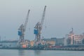 View of harbor cranes and buildings of the seaport in Gdansk, Poland Royalty Free Stock Photo