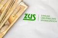 ZUS logo and polish money