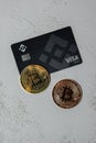 Gdansk Poland - May 2022 Bitcoin gold coin with Black Binance Card mining trading concept. Visa debit card BNB, Binance