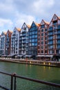 Gdansk, Poland May 2022, Modern buildings on Granary Island over the Motlawa River in Old Town. Tourism on the Motlawa Royalty Free Stock Photo