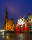 Beautiful illumination of the The Artus Court and Gdans Main Town Hall, Gdansk, Poland Royalty Free Stock Photo