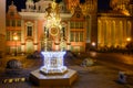 Illuminated fountain in front of the Royal Chapel of St Mary Basilica at the Old Town of