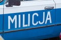 Milicja sign at car. Milicja is old name for police in Poland.