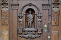 Gdansk, Poland - November 19, 2017:Old door with carved wooden sculptures in Gdansk Poland