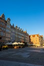 Old town with historical buildings and open-air cafe against a clear blue sky in Gdansk, Poland Royalty Free Stock Photo