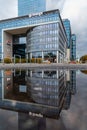 Olivia Star corporate building reflected in puddle Royalty Free Stock Photo