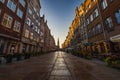 Beautiful long and old Dluga street with old buildings on both sides and beautiful and high red