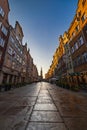 Beautiful long and old Dluga street with old buildings on both sides and beautiful and high red