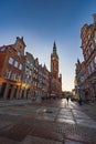 Beautiful long and old Dluga street with old buildings on both sides and beautiful and high red