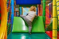 Gdansk, Poland: 30th December 2018 - Child trying to climb over an abstacle on a softplay