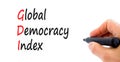 GDI global democracy index symbol. Concept words GDI global democracy index on paper on a beautiful white background. Businessman