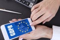 GDPR, General Data Protection Regulation, European Data Privacy Law. Female hand and mobile phone with EU flag and GDPR text