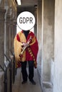 GDPR - a man in a medieval troubodour costume, his face is hidden by the inscription General Data Protection Regulation. Cyber Royalty Free Stock Photo
