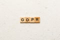 GDPR word written on wood block. general data protection regulation text on cement table for your desing, concept Royalty Free Stock Photo