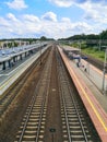 long Train platforms at Gdynia Orlowo station with long train rails seen from high footbridge over Royalty Free Stock Photo