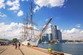 Gdynia, Poland - June 8, 2019: Polish frigate Dar Pomorza at the Baltic Sea with Sea Towers skyscraper in Gdynia Royalty Free Stock Photo