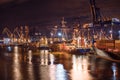 Gdynia, Poland - 09.01.2017: Ship loading cranes working with heavy containers in the port of Gdynia, Poland. Loading Royalty Free Stock Photo