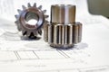 The gear after manufacturing on the gear cutter lies on the technical drawing Royalty Free Stock Photo