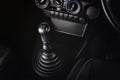 Gear stick of manual transmission of car with 6-speed and reverse position. Royalty Free Stock Photo