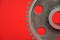 Gear wheel on the red background. Royalty Free Stock Photo