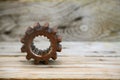 Gear on wooden background, Machine parts or spare parts, industry background, old gear or damaged gear from hard work Royalty Free Stock Photo