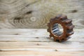 Gear on wooden background, Machine parts or spare parts, industry background, old gear or damaged gear from hard work Royalty Free Stock Photo