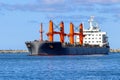 Geared bulk carrier close up. Royalty Free Stock Photo