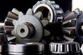 Gears, bearings and differential stars lie on the table close-up