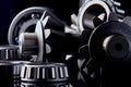 Gears, bearings and differential stars lie on the table close-up