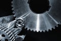 Gears and cogwheels set against black background