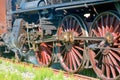 Gears and driving wheels of an old steam train locomotive