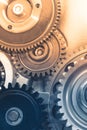 Gears industrial background with warm shiny light Royalty Free Stock Photo