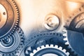 Gears industrial background with warm shiny light Royalty Free Stock Photo