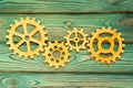 Gears made of wood on a wooden background. Royalty Free Stock Photo